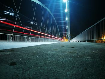 Light trails on suspension bridge at night