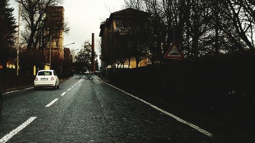 Cars on road against sky