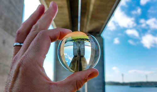 Close-up of person holding glass