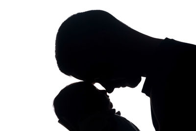 Close-up of silhouette man against white background