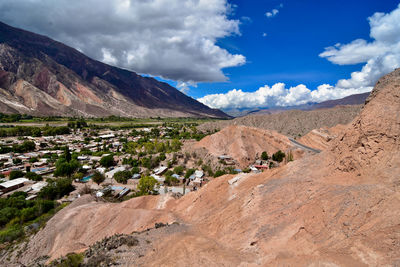 Scenic view of landscape and mountains against sky