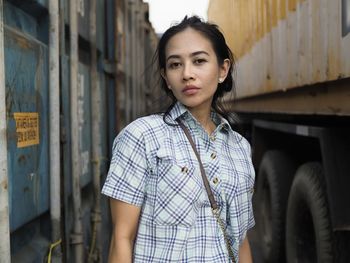 Portrait of beautiful young woman looking away