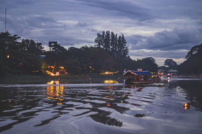 Scenic view of lake against sky at dusk