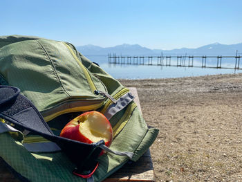 High angle view of fruits on beach against sky