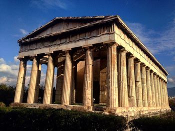 Low angle view of built structure against blue sky