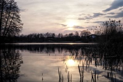 Scenic view of lake against sky during sunset