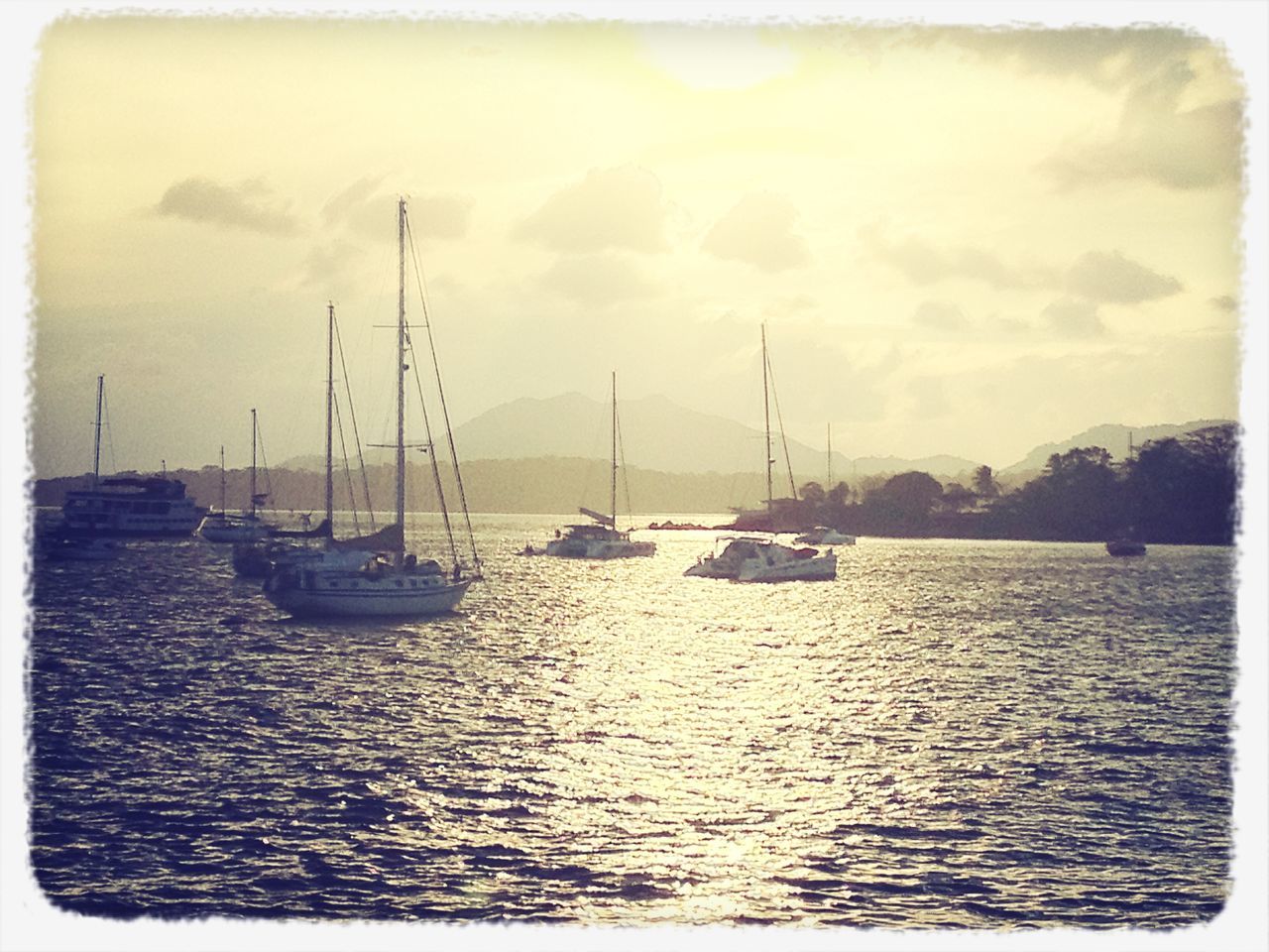 nautical vessel, water, transportation, boat, mode of transport, transfer print, sea, moored, sailboat, sky, auto post production filter, waterfront, mast, tranquility, tranquil scene, nature, beauty in nature, scenics, sailing, rippled