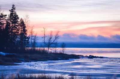 Scenic view of sea against sky at sunset