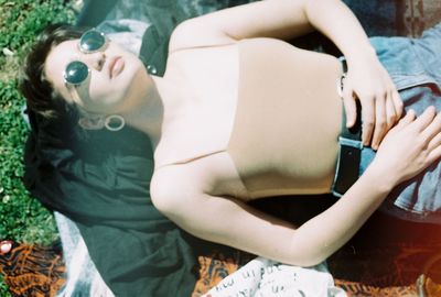 Midsection of women sitting outdoors