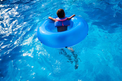 High angle view of woman swimming in pool