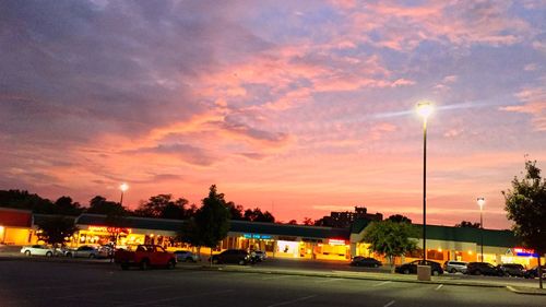 Cars on road at sunset