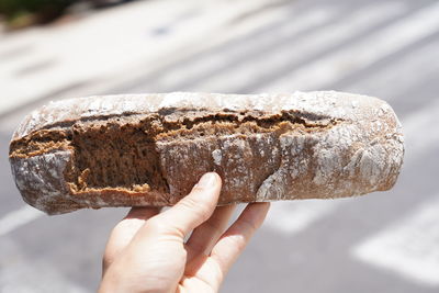 Close-up of hand holding bread