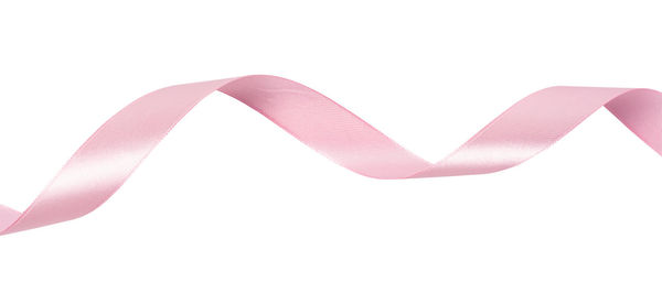 High angle view of pink paper over white background