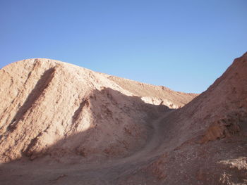 Scenic view of mountains against clear blue sky