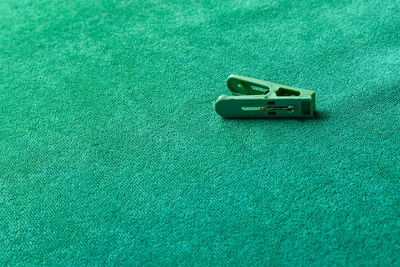 Close-up of clothespin on table