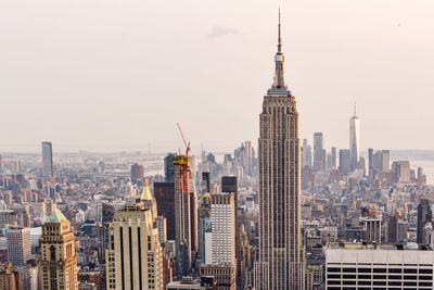 Empire state building amidst cityscape