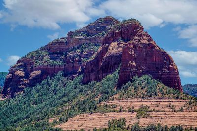 View of rock formation on mountain against sky