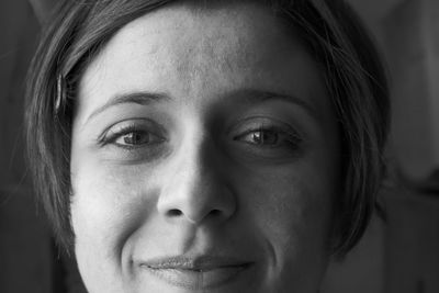 Close-up portrait of woman at home