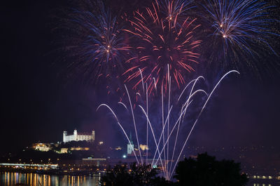 Firework display in sky at night