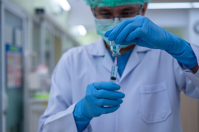 Midsection of man wearing mask