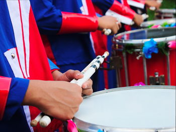 Close-up of hands playing drums