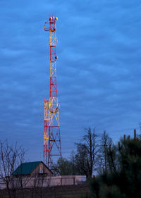 Low angle view of communications tower against sky