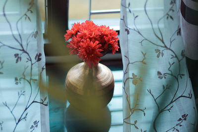 Close-up of flower vase on table