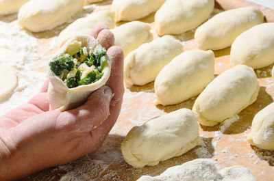 Close-up of hand holding vegetables