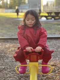 Toddler enjoys see saw