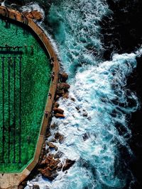 High angle view of water flowing through rocks