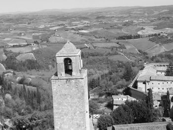 Aerial view of temple and buildings against sky