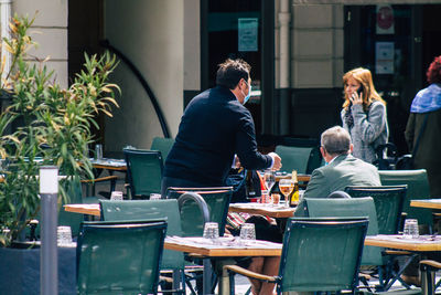 Rear view of people sitting in restaurant