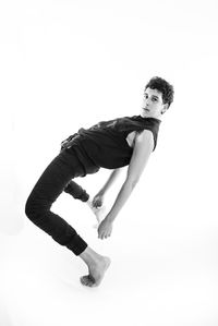 Portrait of young man against white background