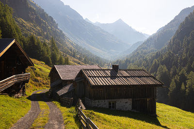 Houses and mountains against sky