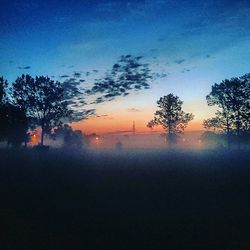 Scenic view of landscape against sky at dusk