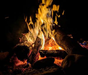 Close-up of bonfire on field at night