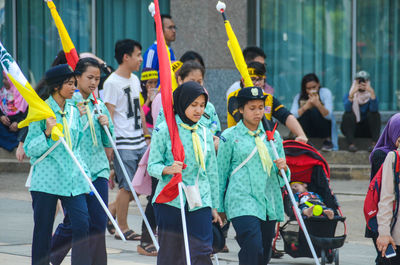 Group of people walking in city