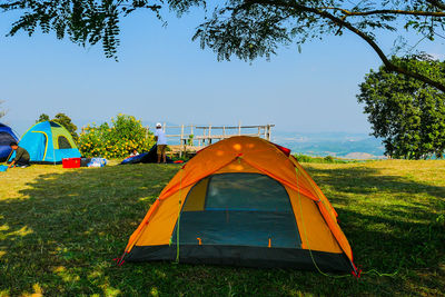 Tent on field against clear sky