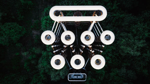 Aerial view of factory by trees in forest