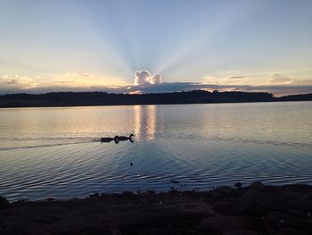 Scenic view of sunset over lake