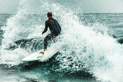 People surfing in sea