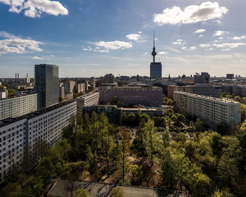 Cityscape against cloudy sky