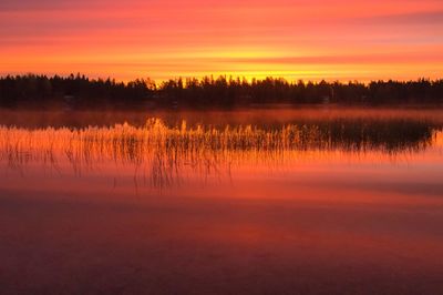 Scenic view of lake during sunset