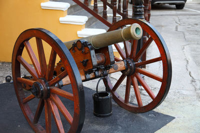 Close-up of old wheel on street