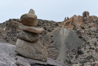 Stack of rocks against sky