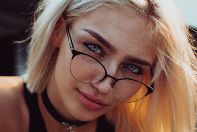 Close-up portrait of woman wearing eyeglasses