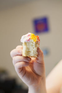 Close-up of hand holding ice cream