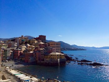 View of town against clear blue sky