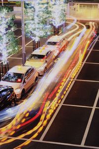 High angle view of light trails on road in city