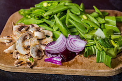 High angle view of mushrooms and leaves on table